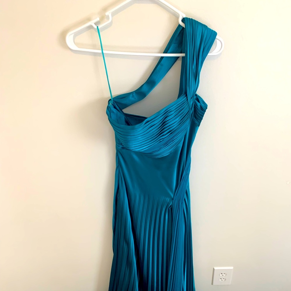 Cache size 4 turquoise one shoulder ball gown with pleats.